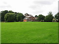 TR1640 : View across the playing fields to Lyminge Church by Nick Smith