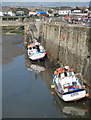 Fishing boats in Porthleven harbour at low tide