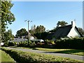 Thatched cottage and road through Dyffryn